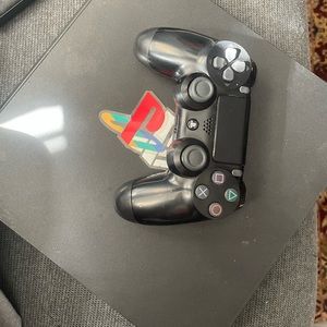 Used PlayStation 4 with a used controller